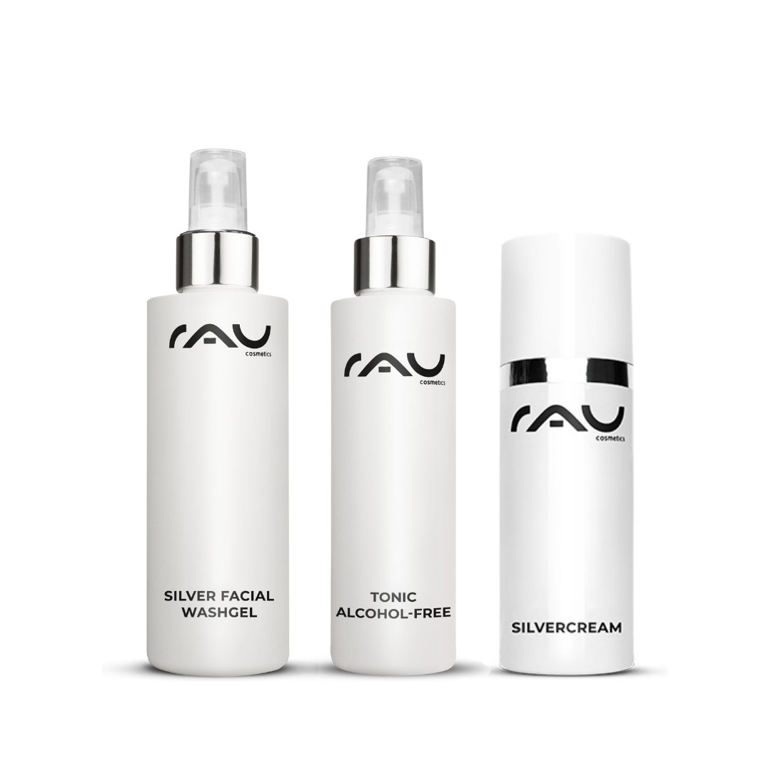 Routine di cura di base per la couperose con i prodotti RAU Cosmetics: gel detergente all'argento, tonico analcolico e crema all'argento in un'elegante confezione.